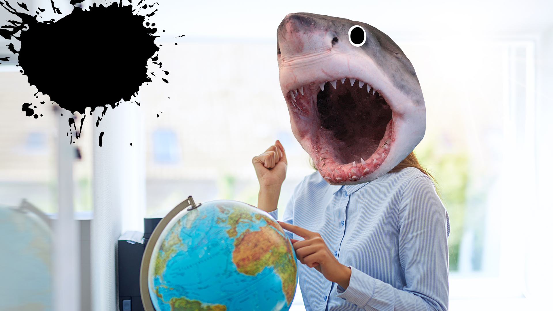 A shark pointing at a globe