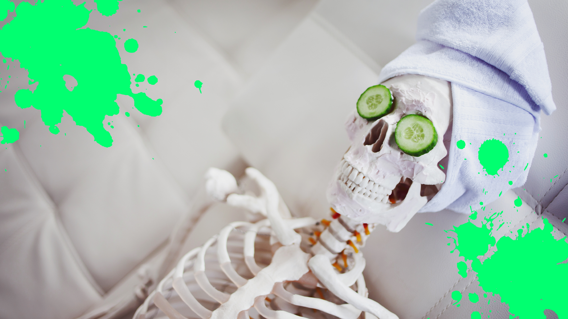 Skeleton having spa day and green splats
