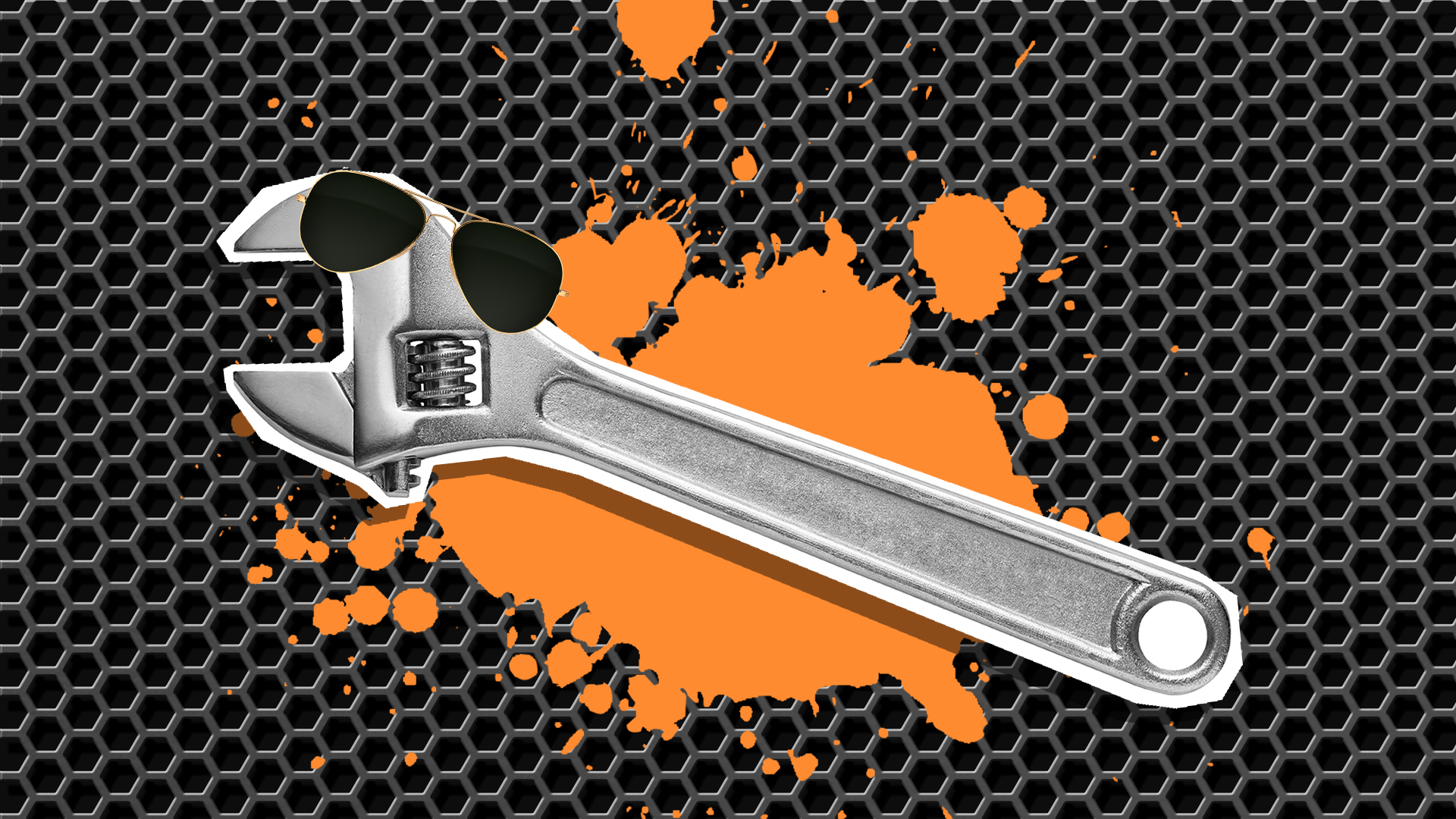 A wrench on a metal patterned background