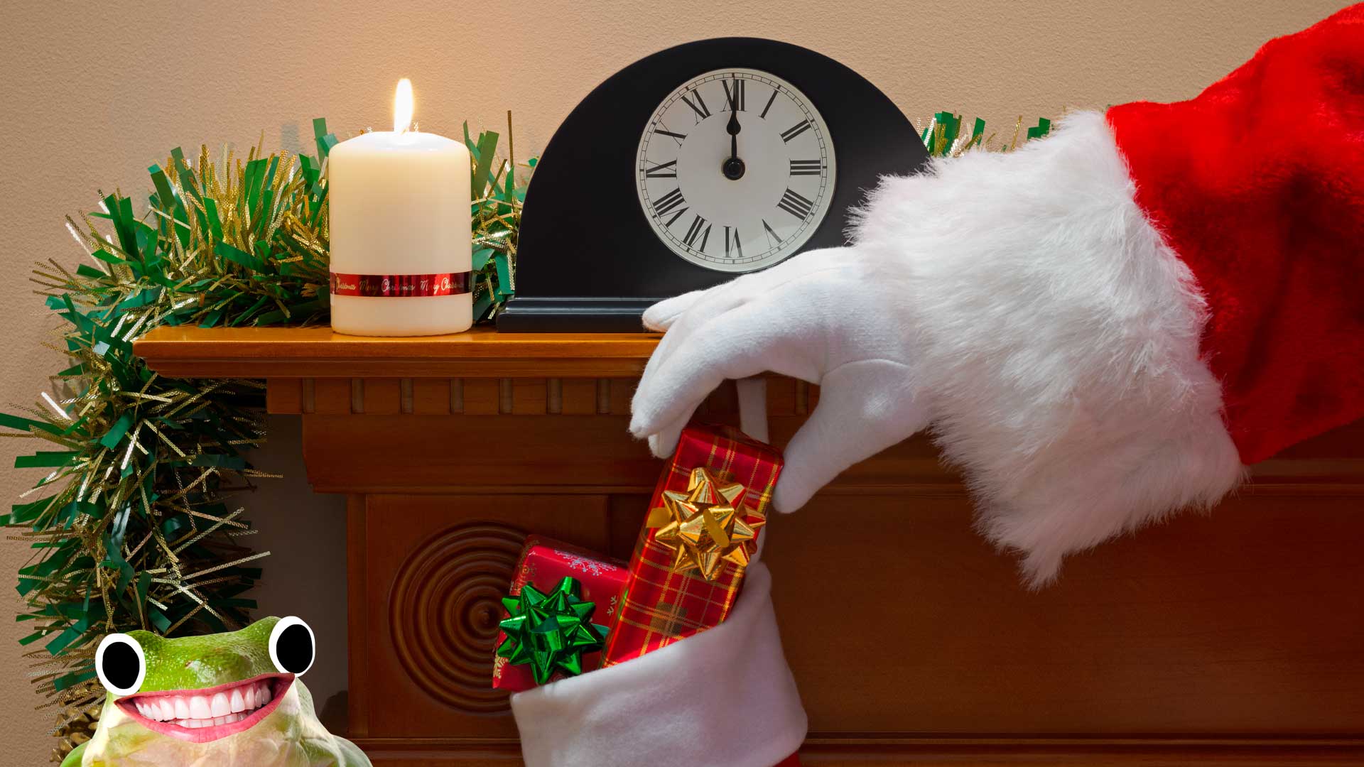 Santa puts gifts into a Christmas stocking while a frog watches