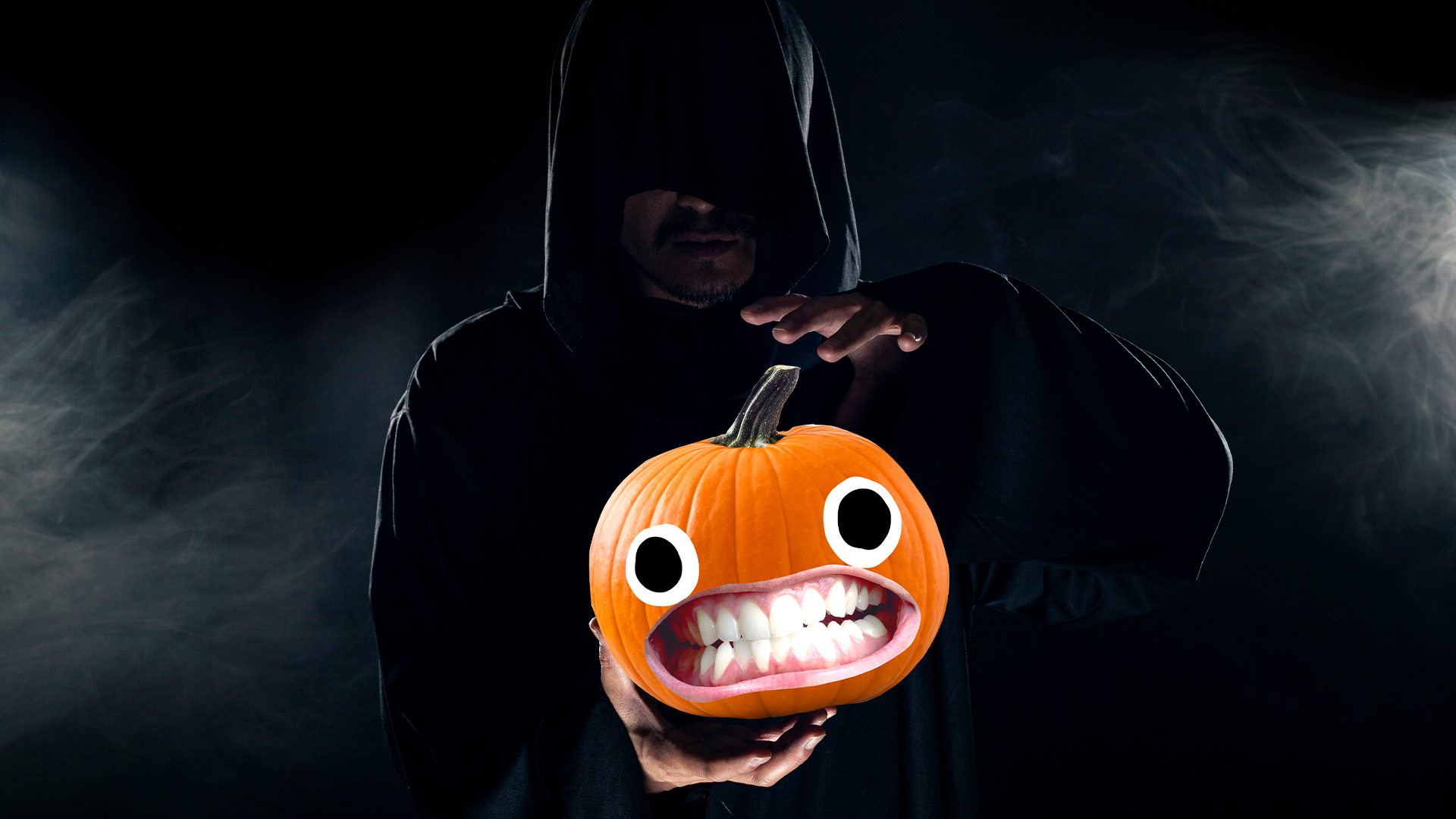 Spooky guy holding Beano pumpkin