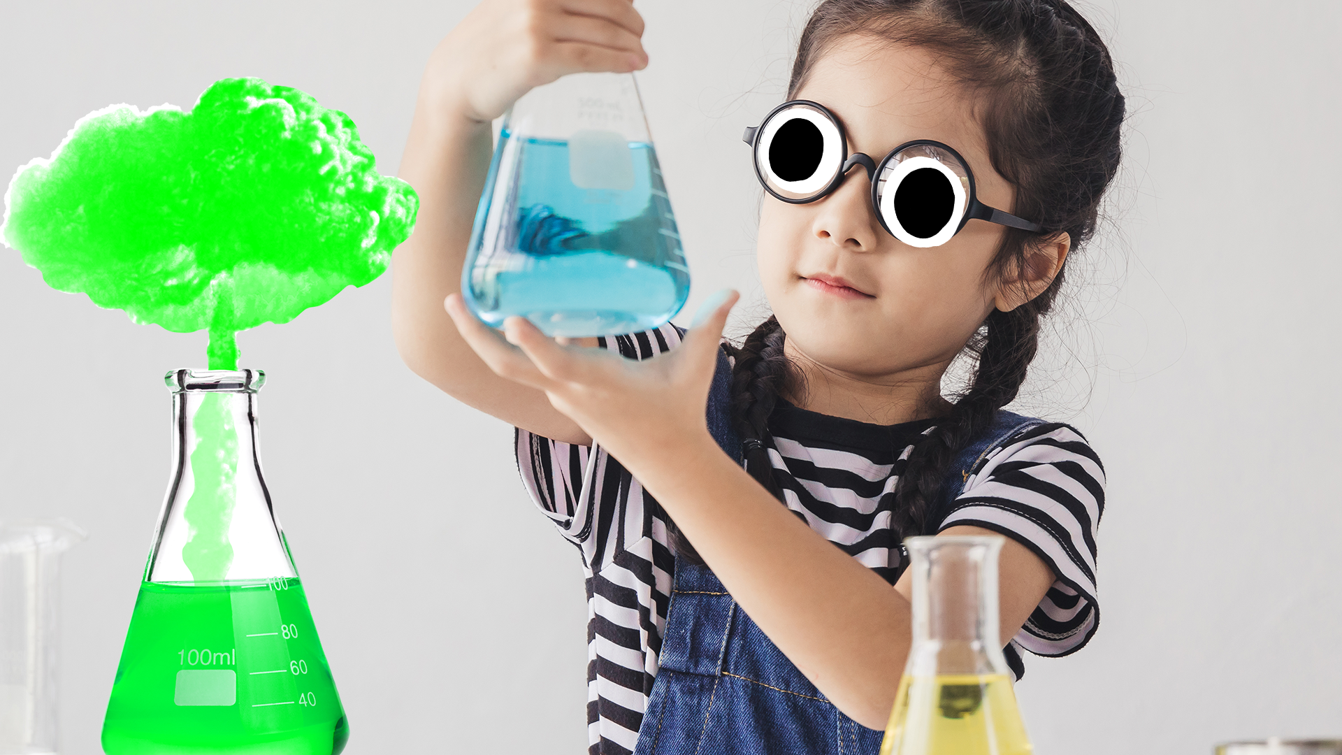 Girl holding up beaker in science experiement