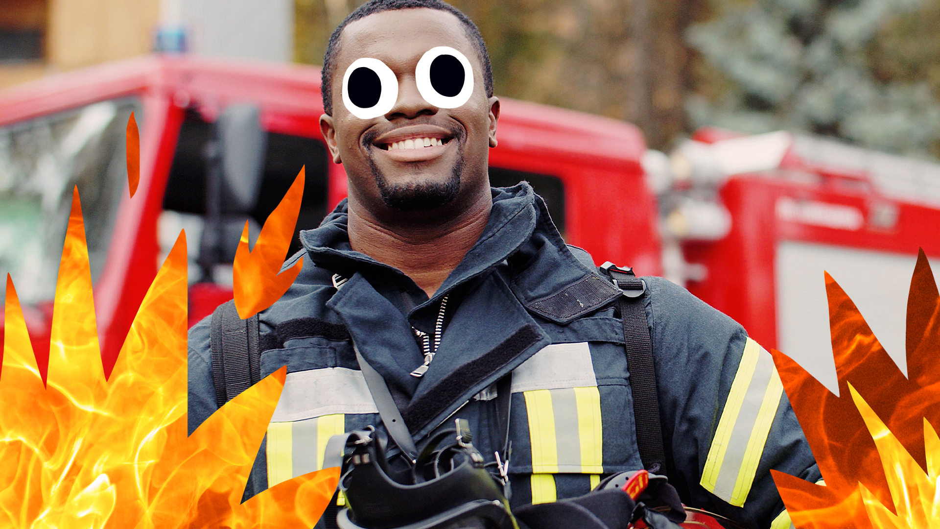 Smiling firefighter with flames