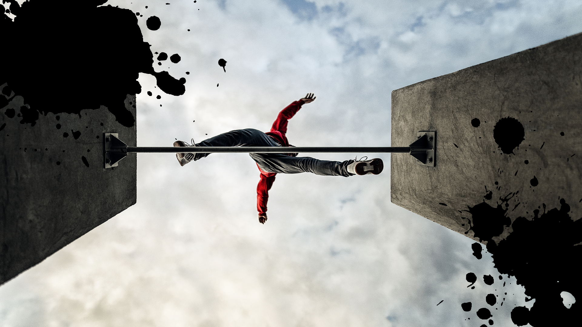 Man jumping between buildings with splats