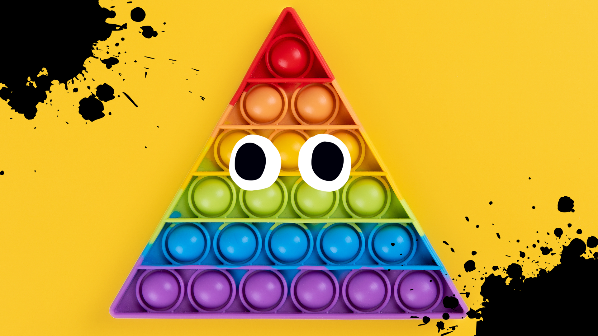 Rainbow triangle on yellow background with splats