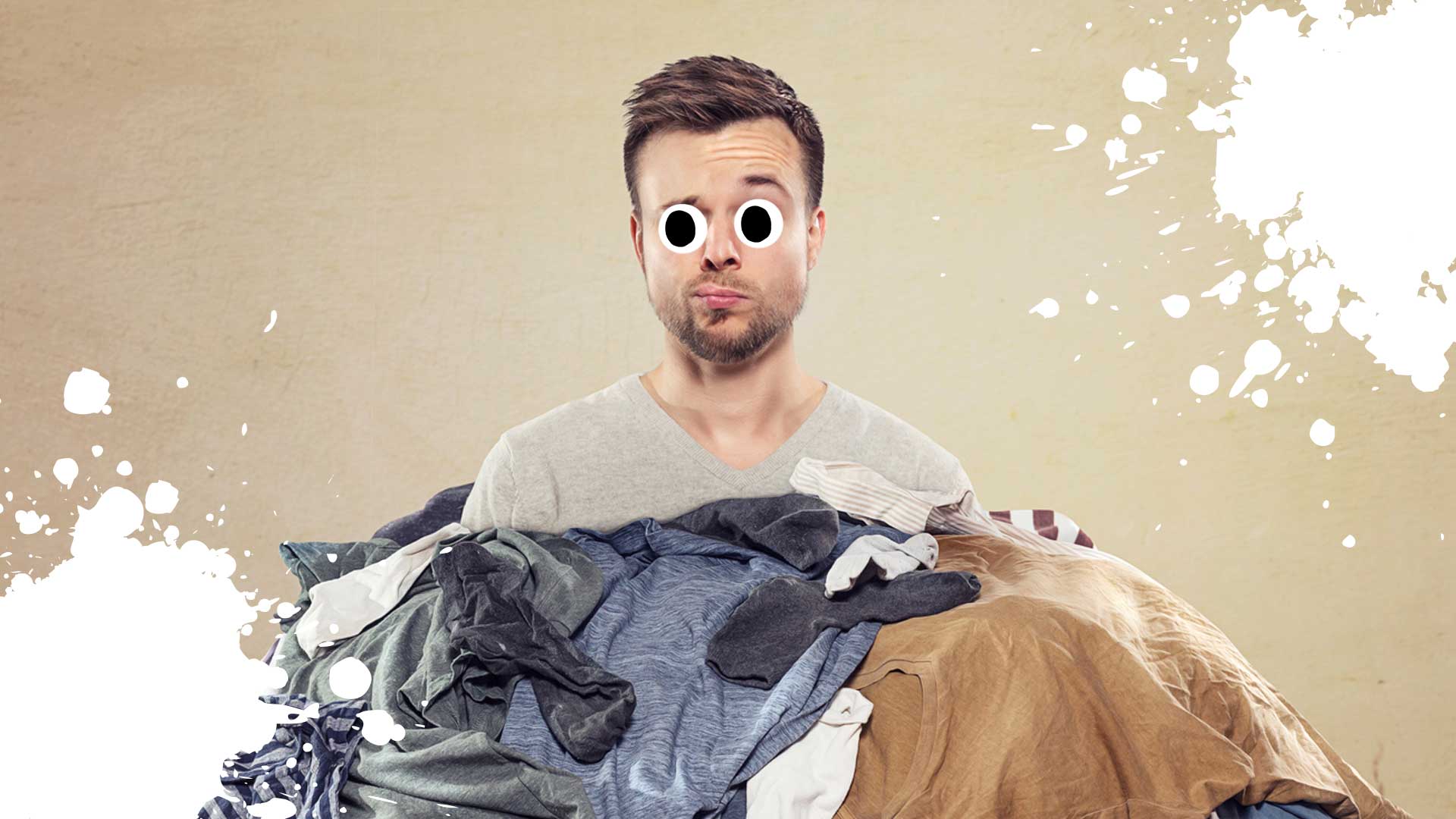 A man with a pile of dirty laundry