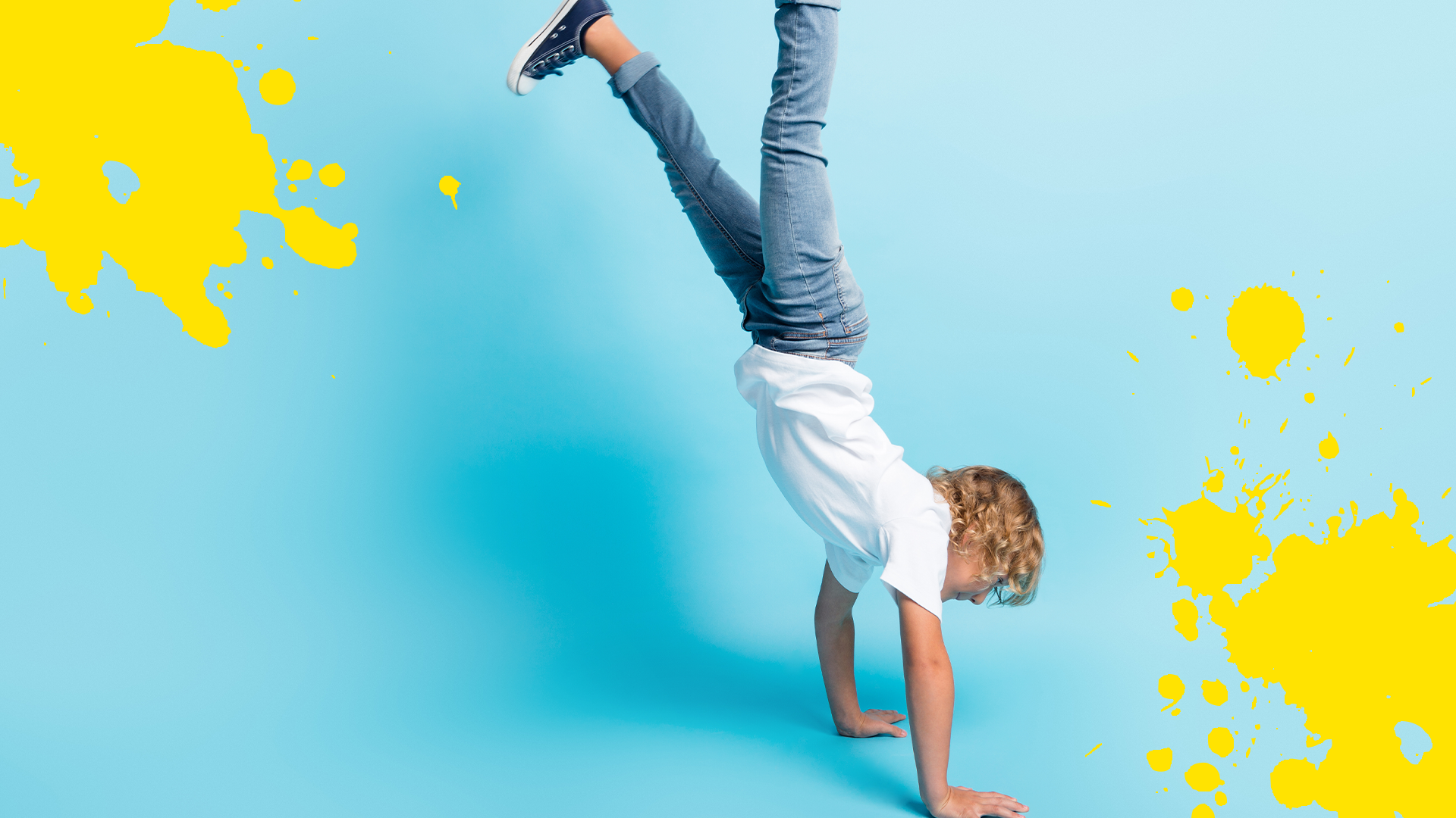 Boy doing a handstand with splats