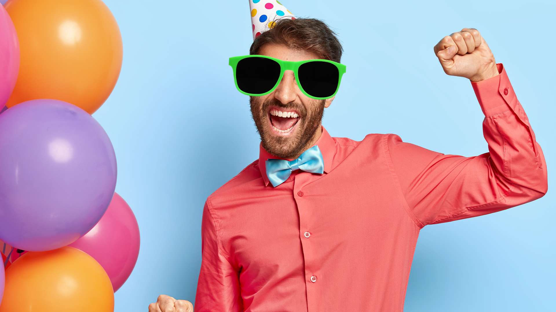 Man celebrating birthday with balloons