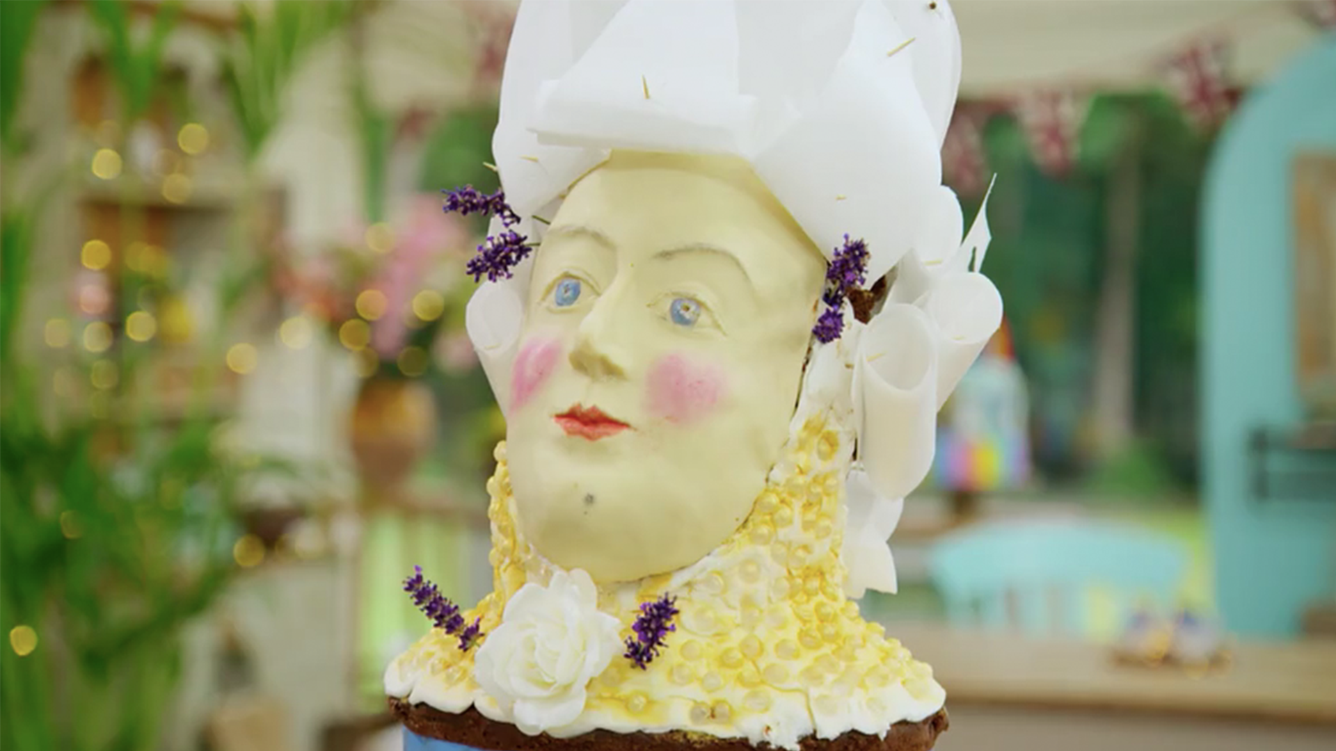 A very fancy cake made to look like a historical figure
