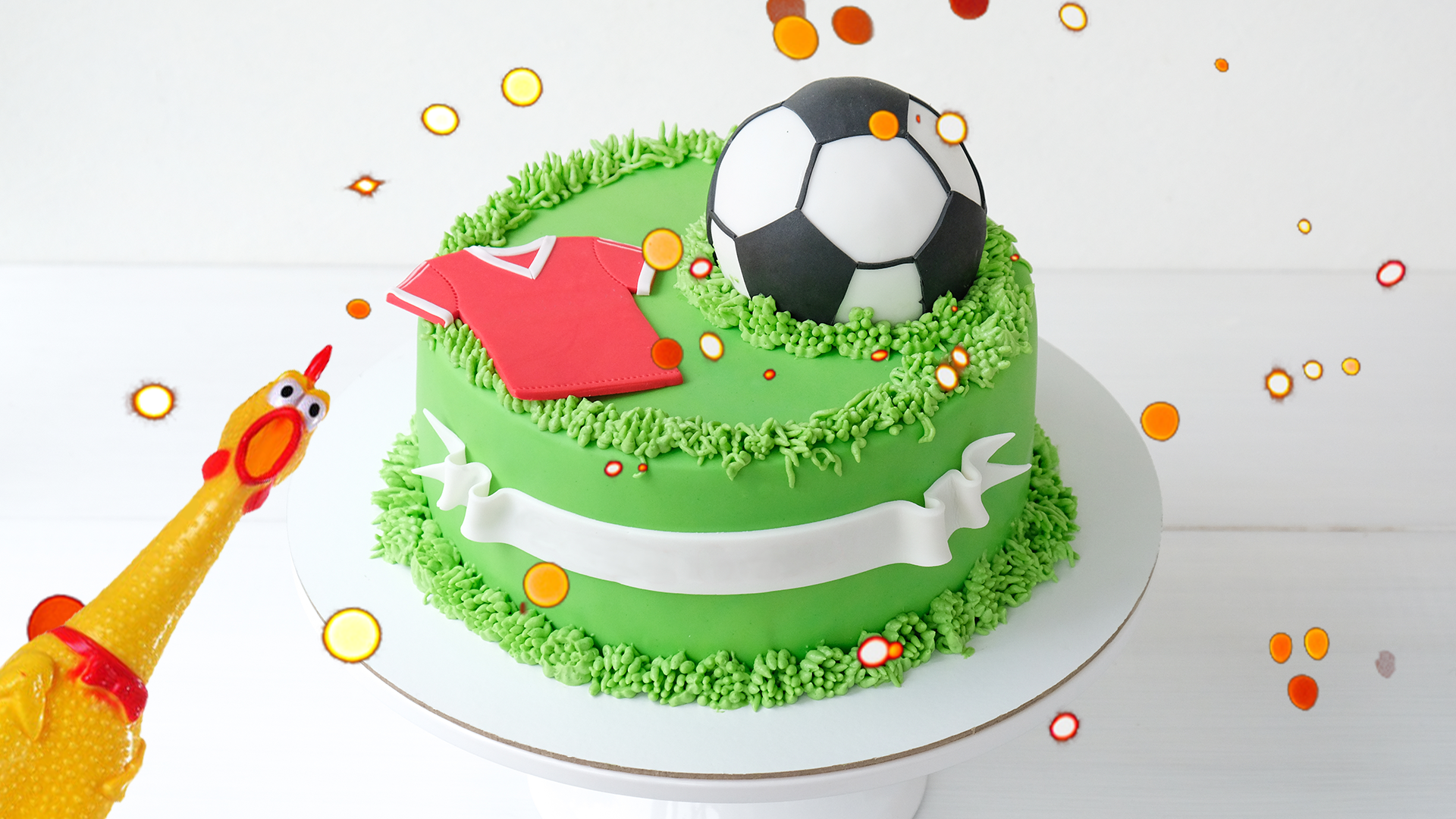 Football cake and rubber chicken