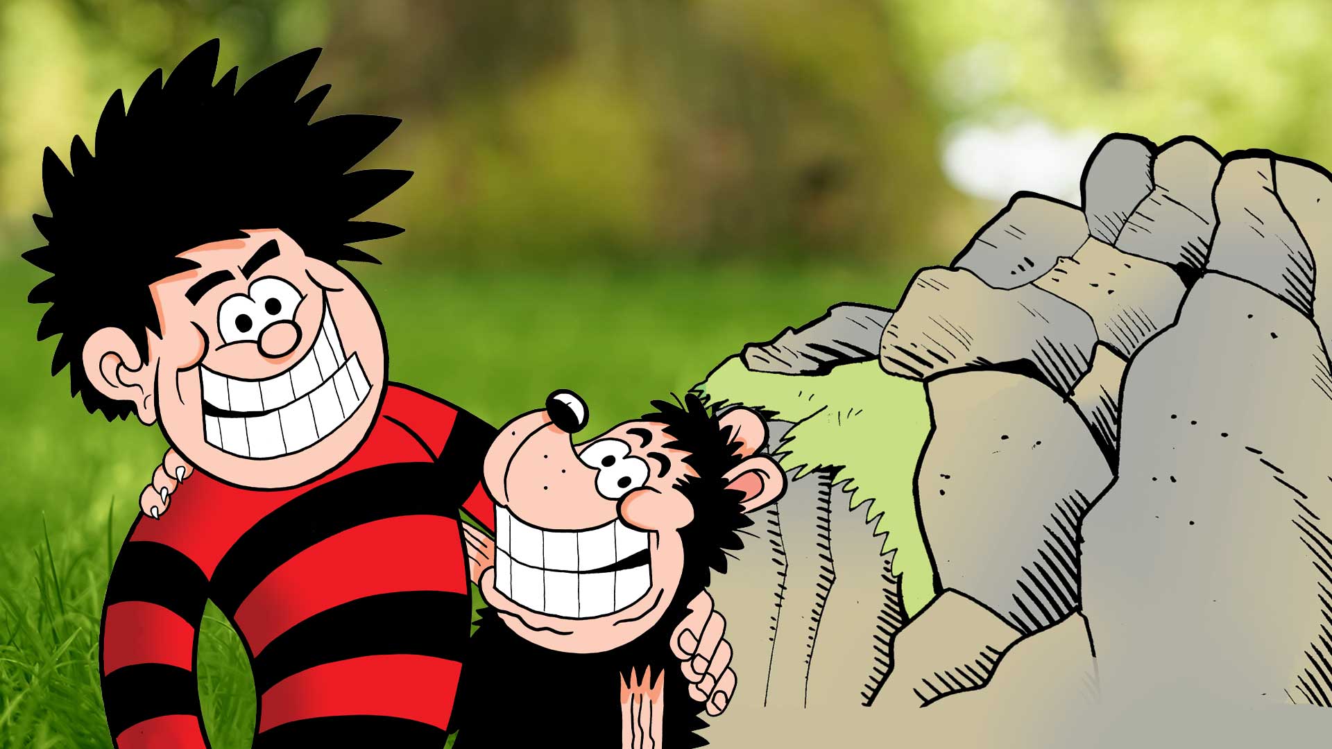 Dennis and Gnasher smiling in a grassy garden