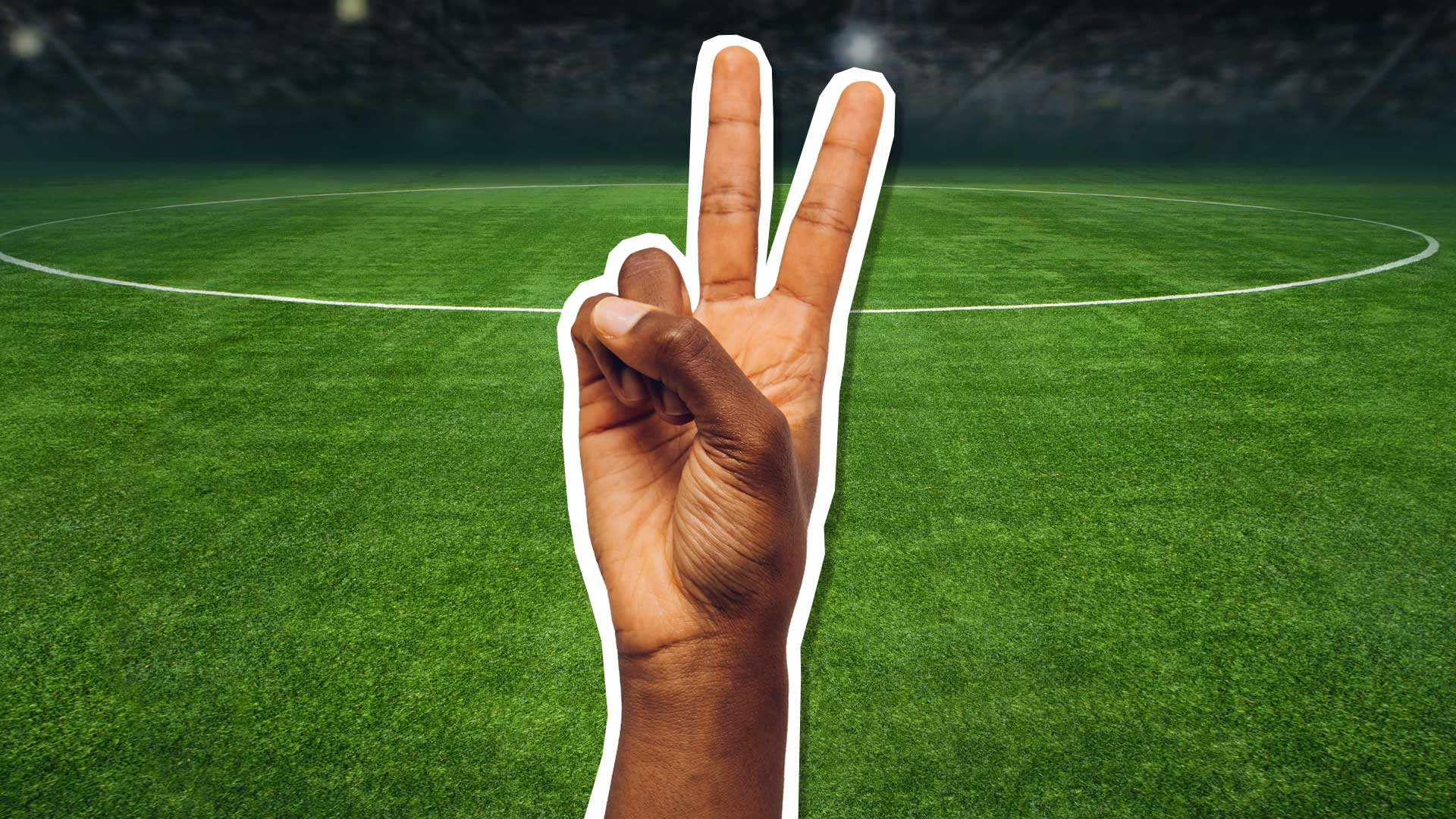 A peace sign on a football field