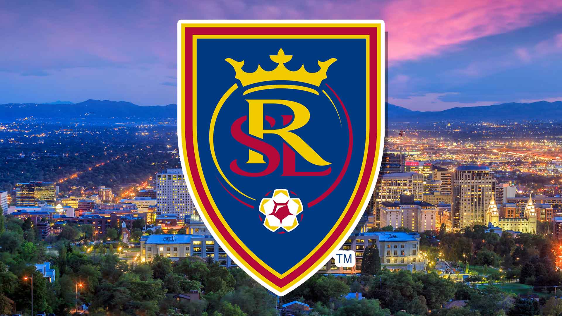 Real Salt Lake badge with the city in the background