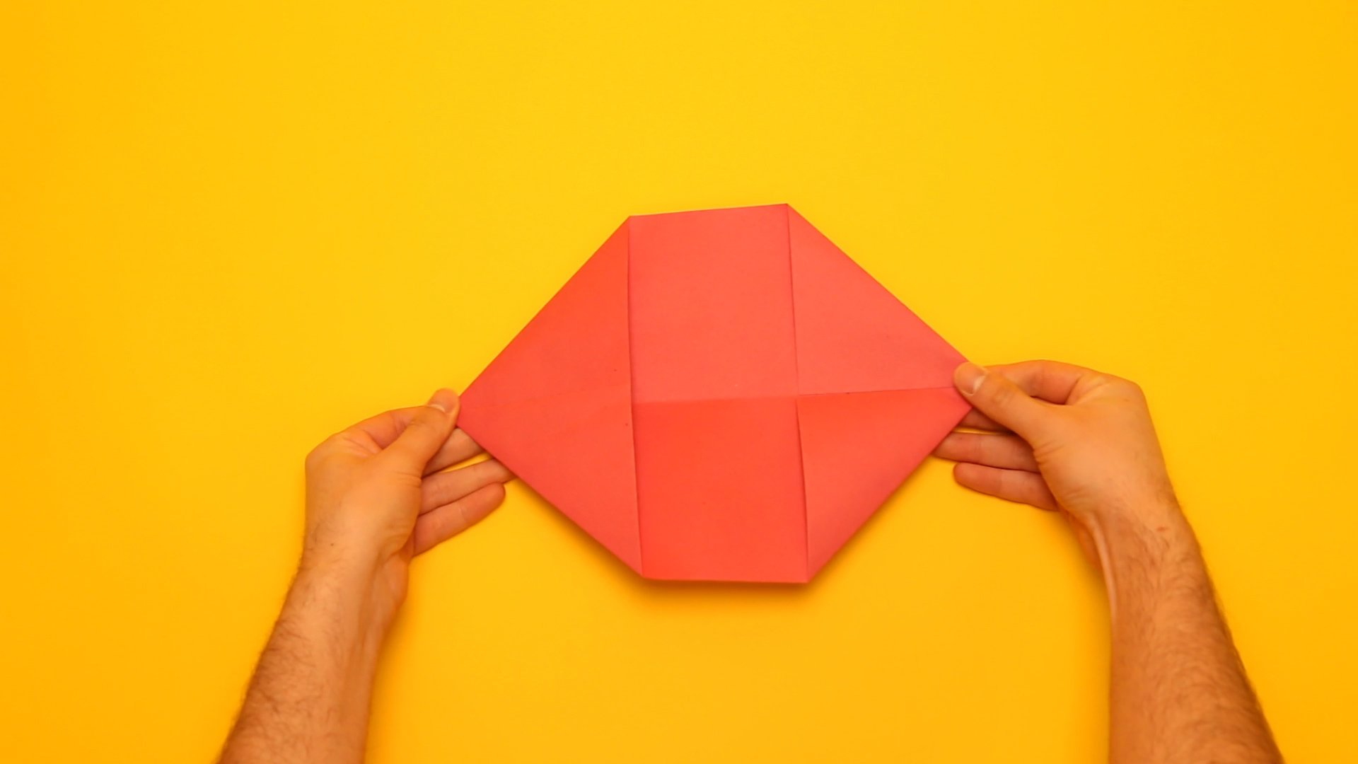 Fold each of the four corners into triangles