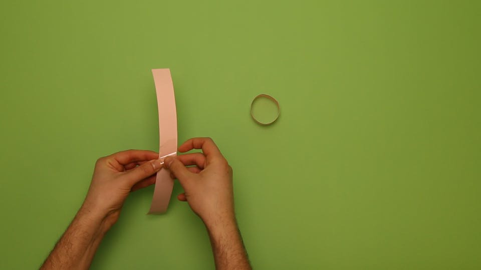 Tape the two strips and make another hoop