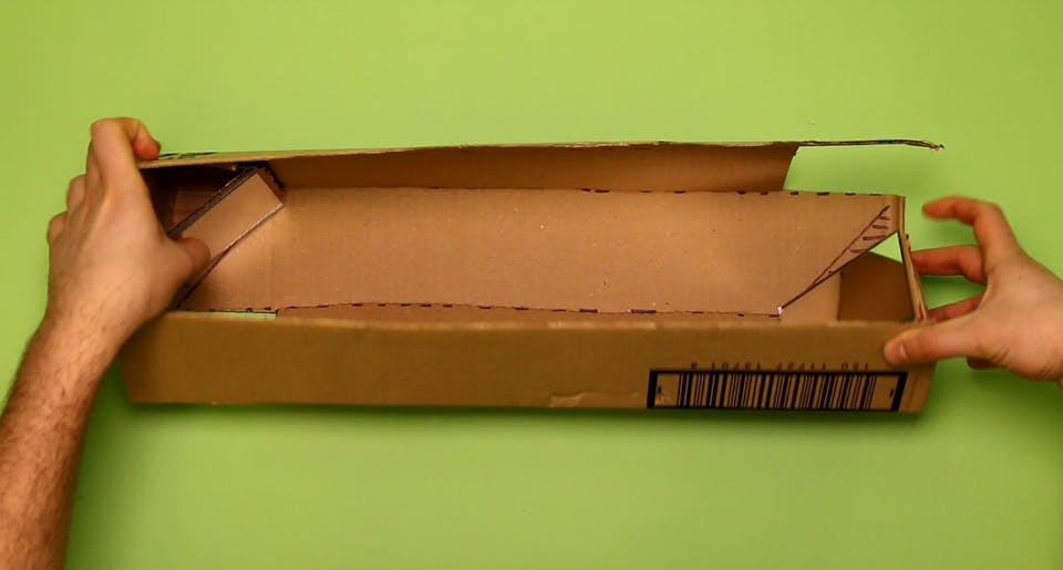 Fold up your cardboard to make a square tube