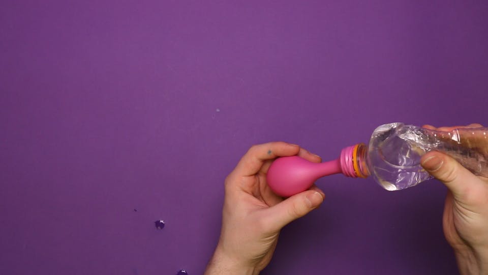 Attach a balloon to a water bottle (or a you can use a tap) and fill it up with water
