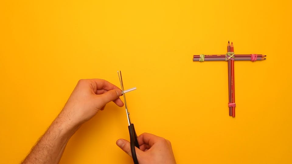 Cut a small piece of drinking straw off with scissors