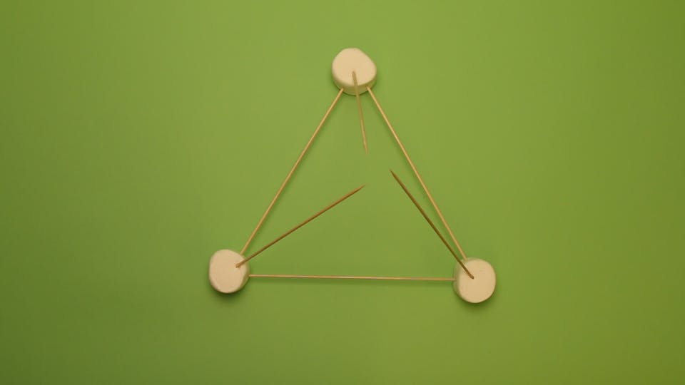 Add 3 more skewers diagonally to create a pyramid