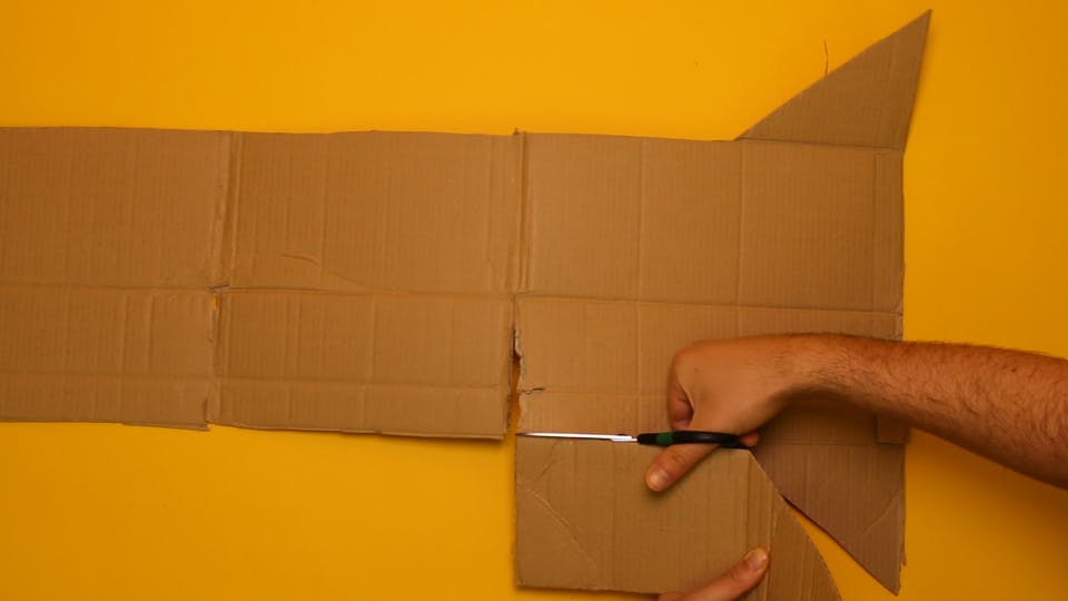 Cut off one end piece of the box, and the 4 flaps from the top and bottom of the box