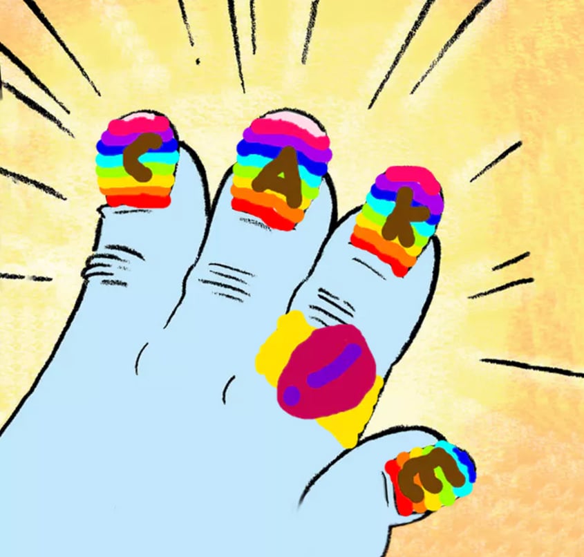 A yeti hand with rainbow painted nails that spell the word CAKE (also a ring with an exclamation mark on it) 