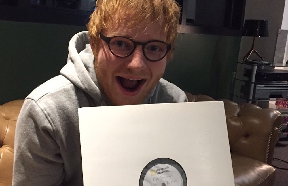 Ed Sheeran lyrics quiz: Ed holding a record