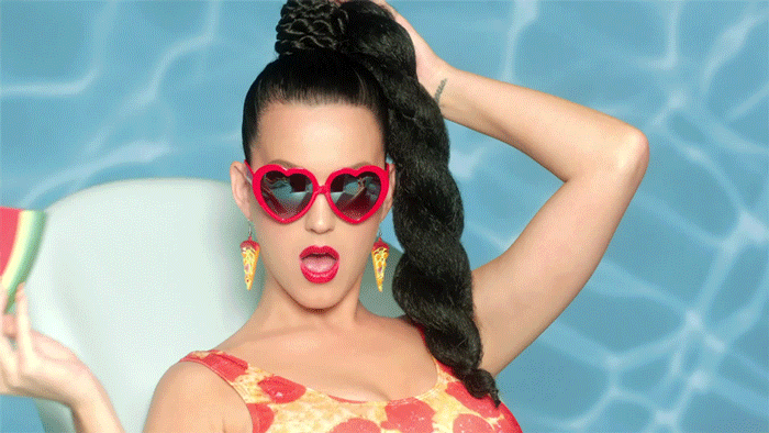 Katy Perry with a handful of melon