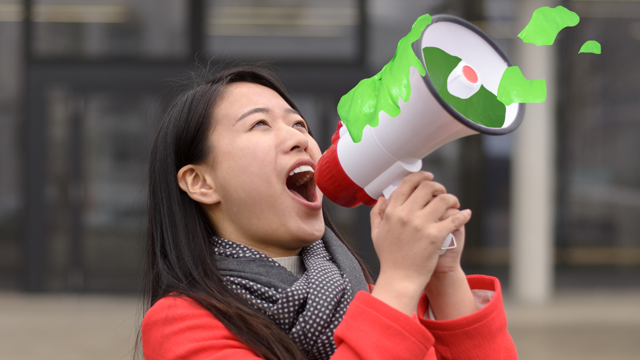Which slime are you? Woman shouting into a slime filled megaphone
