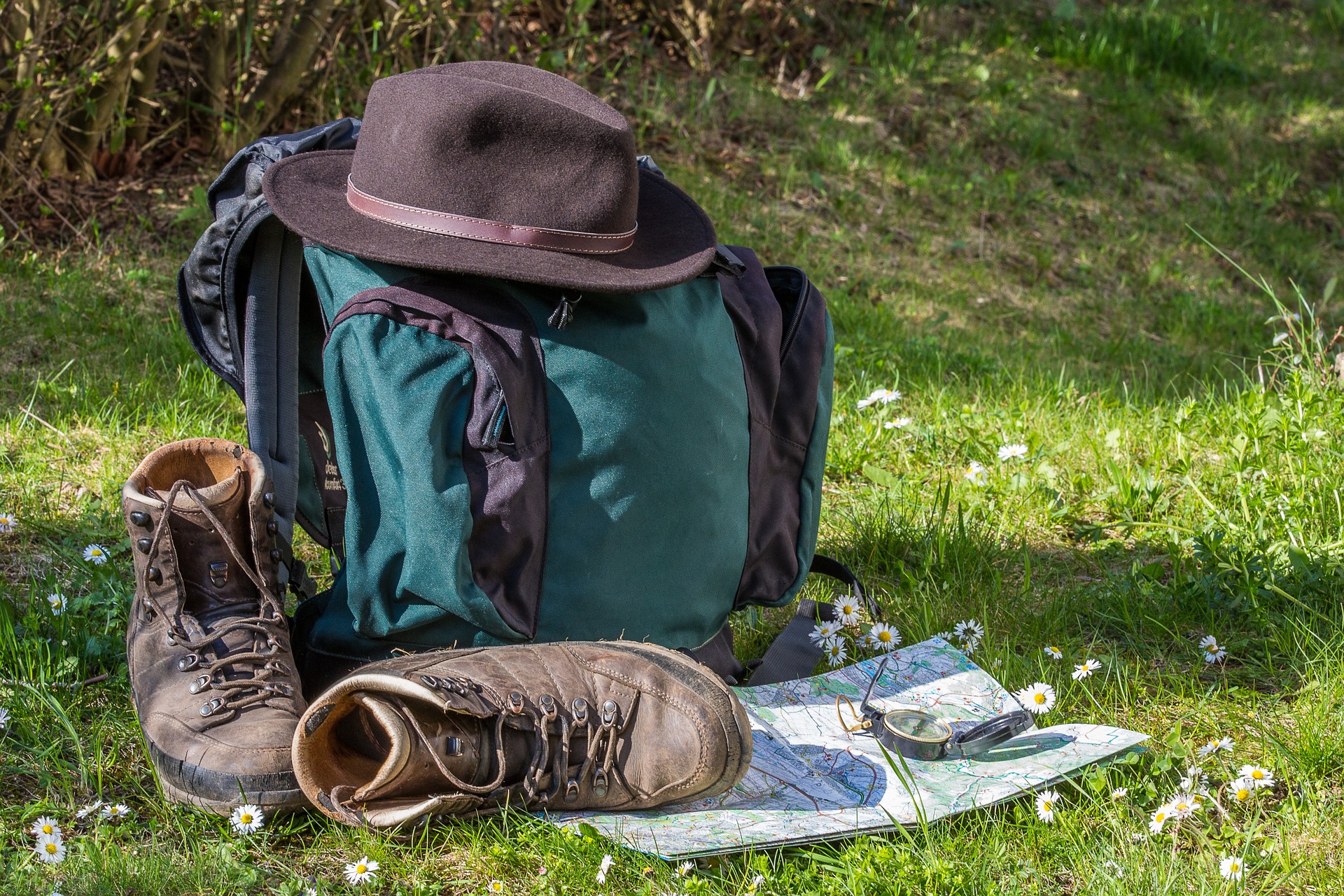 A backpack, hiking boots and a map