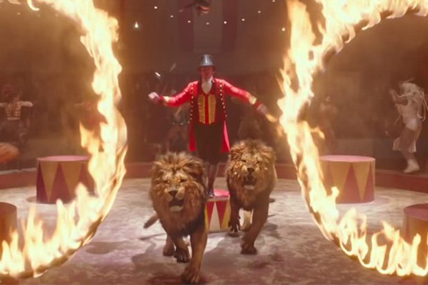 Hugh Jackman performs with two lions in a scene from The Greatest Showman