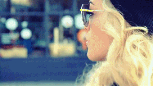 Rita Ora wearing sunglasses in the street