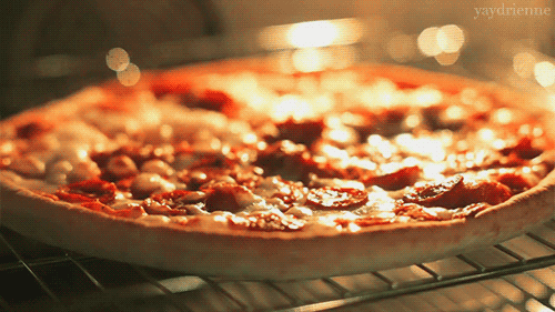 A pizza cooking in an oven