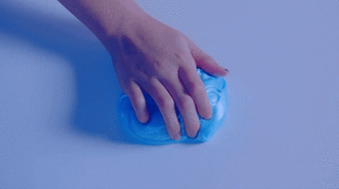 A gif of a hand kneading a ball of slime