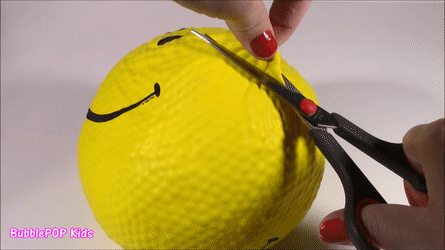 A stress toy is cut open to reveal its shiny contents