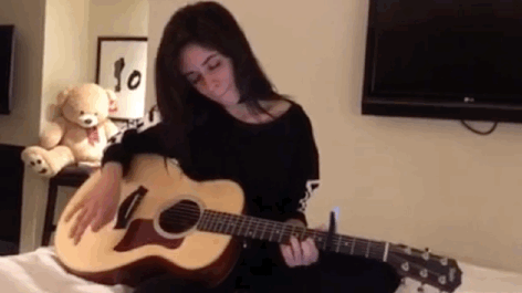 Camila Cabello playing guitar
