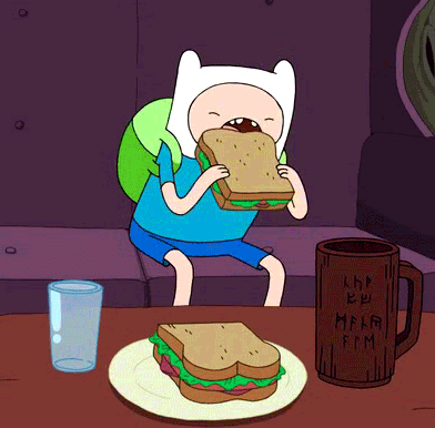 Adventure Time's Jake The Human eating a sandwich