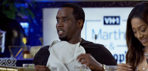 P. Diddy using a napkin