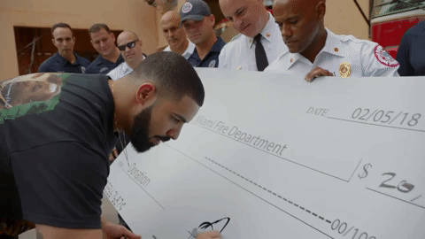 Drake signs a massive cheque!