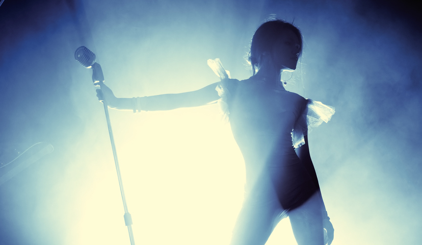 A silhouette of a pop star