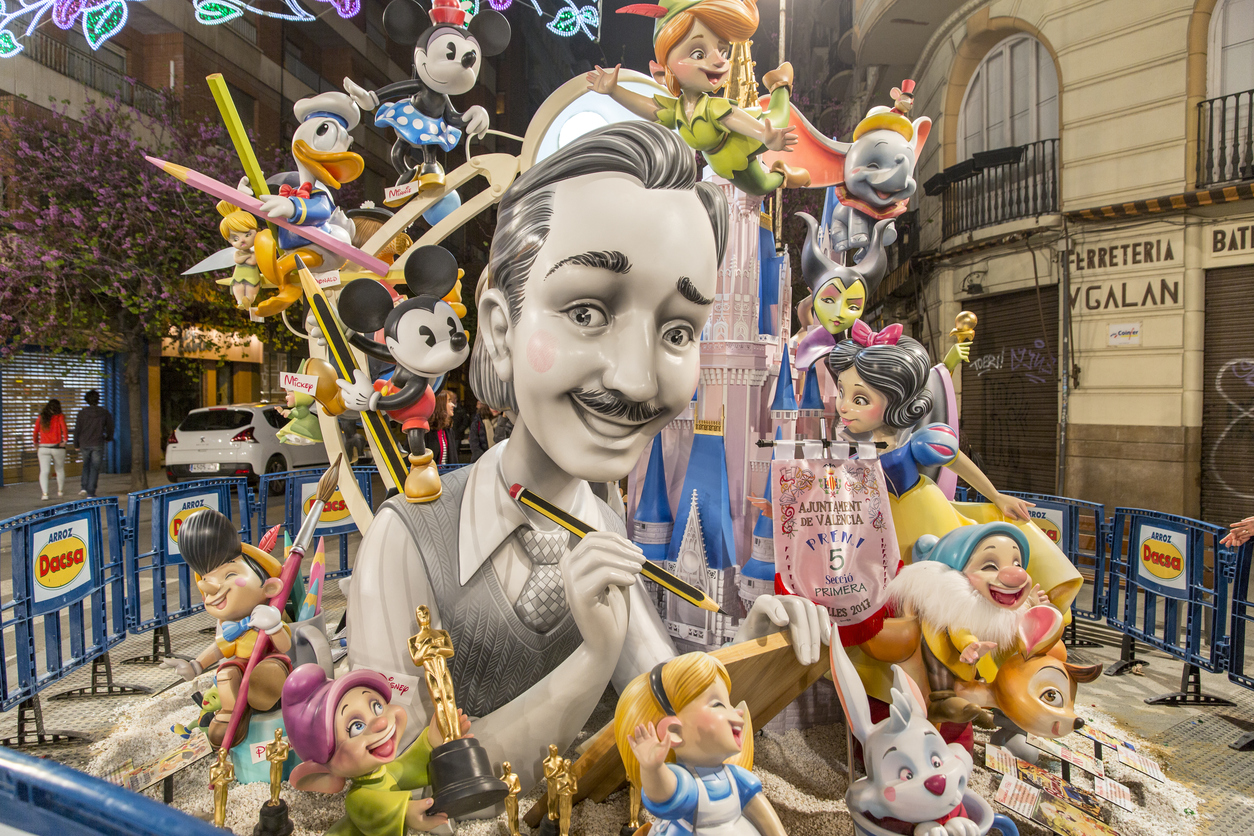 A statue of Walt Disney and his characters