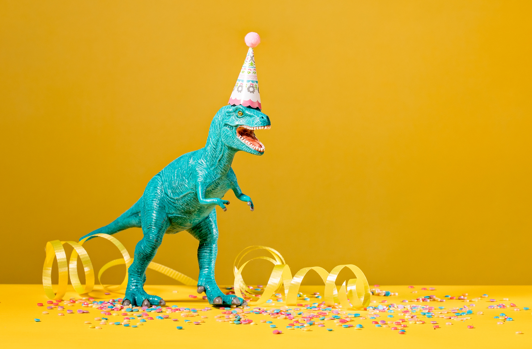 A dinosaur getting into the party spirit