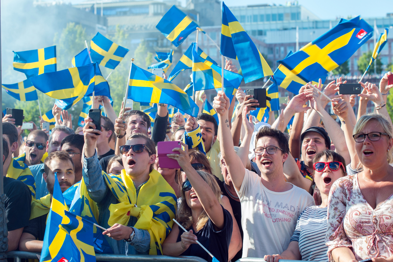 Swedish football fans cheer on their team