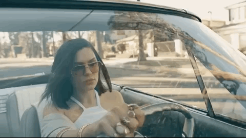 Jessie J driving a car