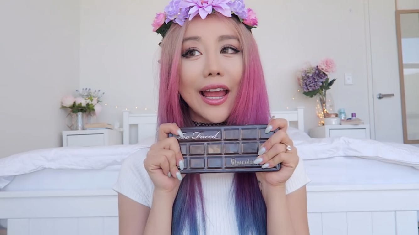 Wengie  quiz: she holds up some cosmetics