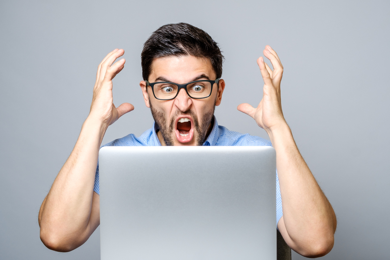 A man shouting at his computer