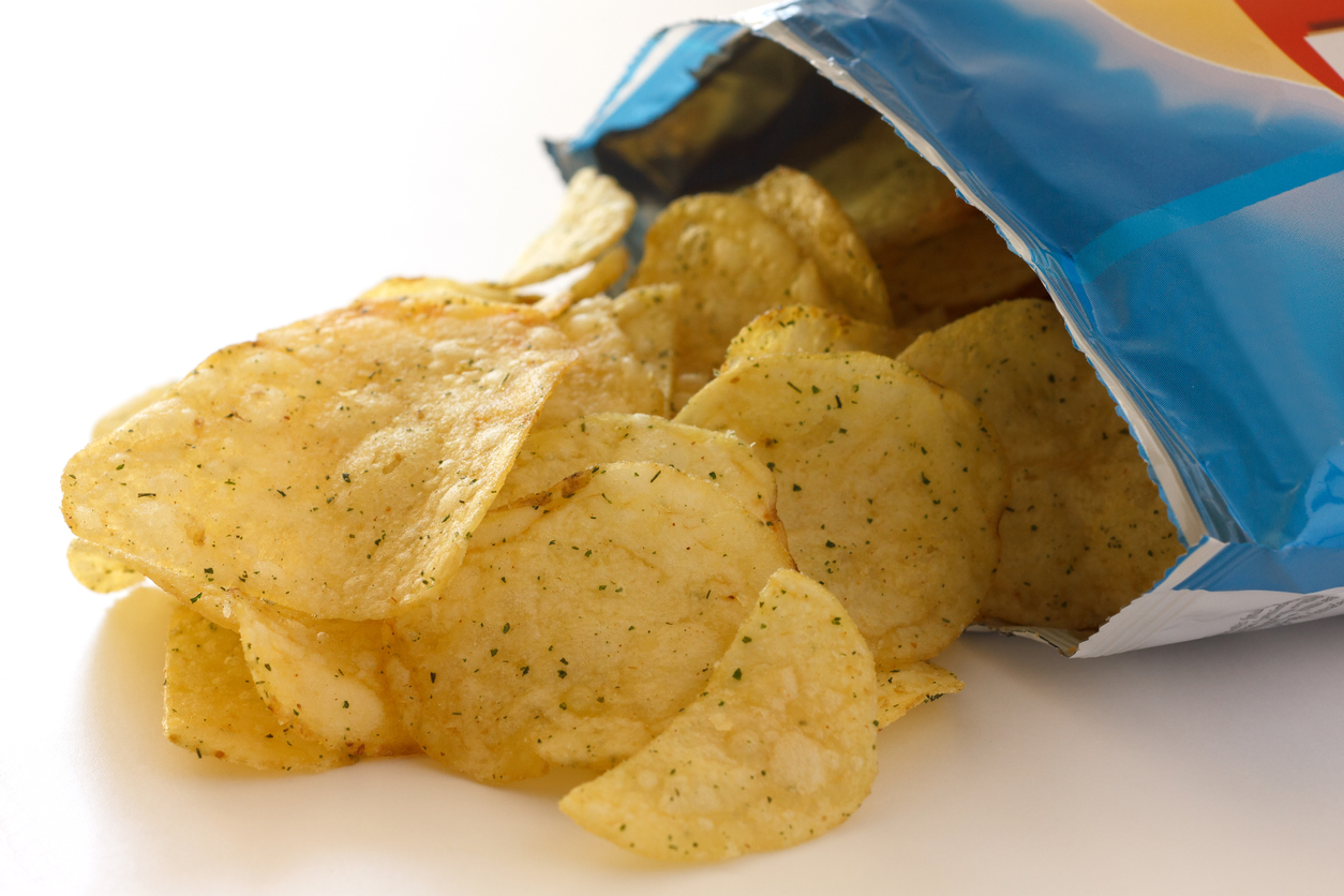 Packet of cheese and spring onion flavour crisps