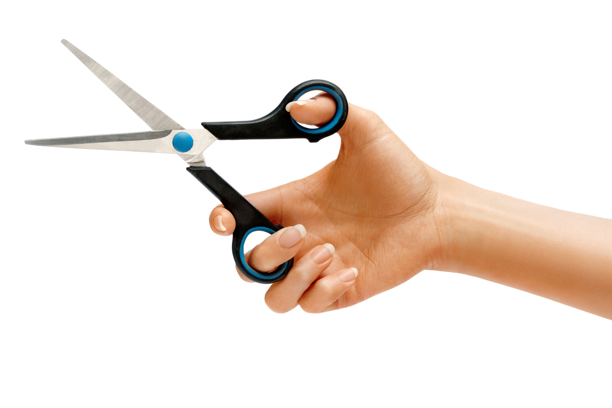 A woman holding a pair of scissors