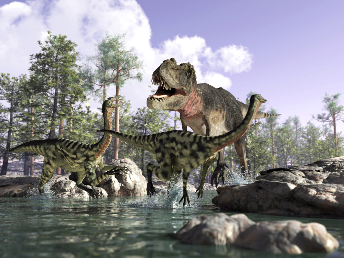 A group of dinosaurs relax next to a lake