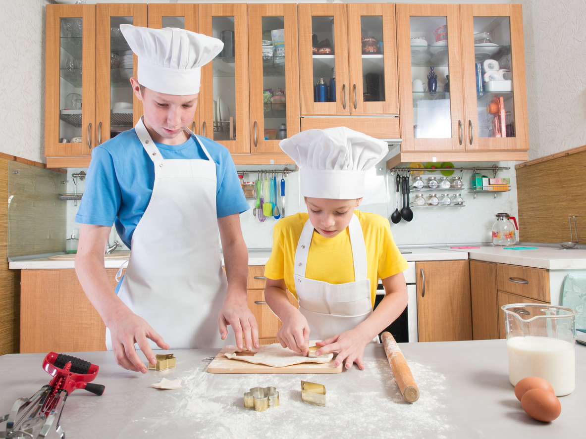 Two people baking in a kitchen 