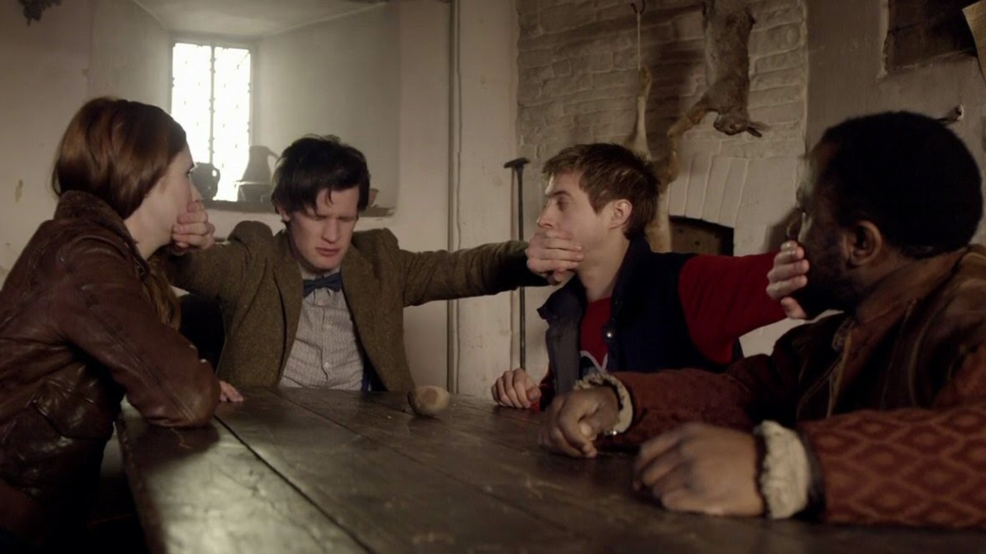 The Doctor stopping Amy, Rory and some Italian guy from talking with his Time-lord hands